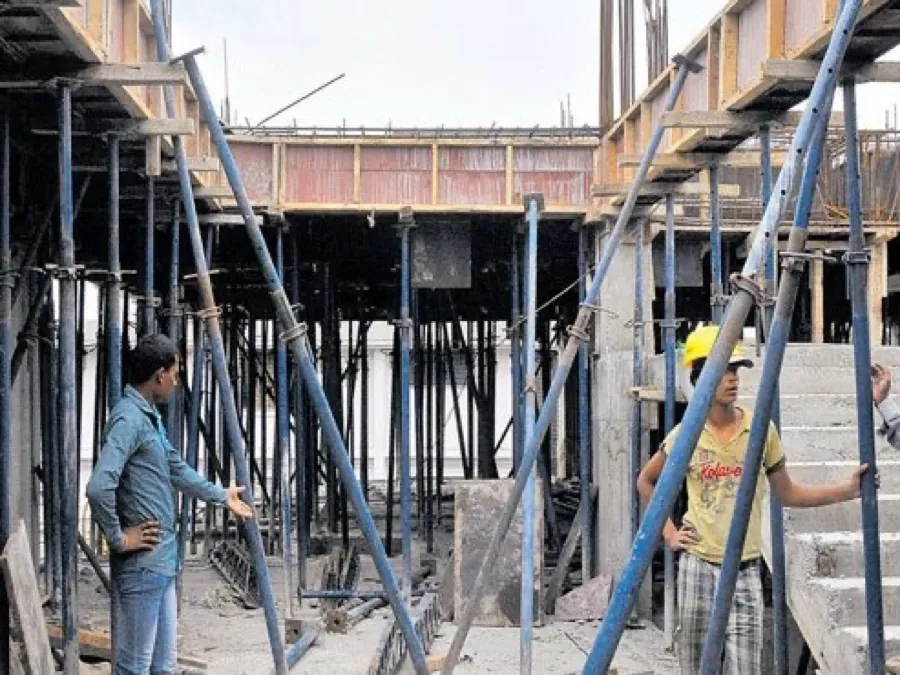Construction site: shoring props and timber formwork supporting a slab, set out by hand rather than to a layout.